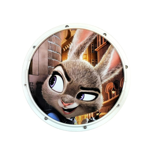 A round drum practice pad kit with a character illustration on the front.