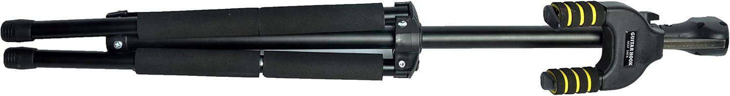 Camera tripod with adjustable legs on a black background