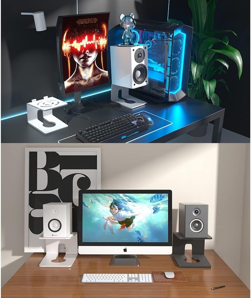 Two computer setups on desks with monitors, keyboards, and speakers.