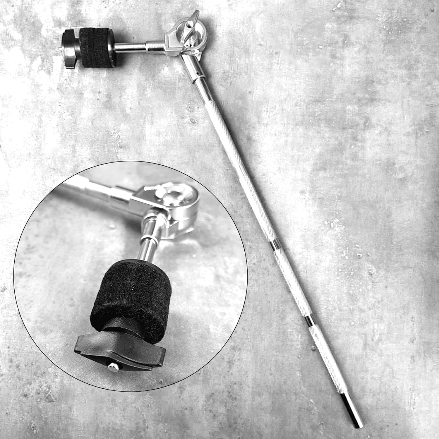 Drum stand with close-up detail on a gray surface
