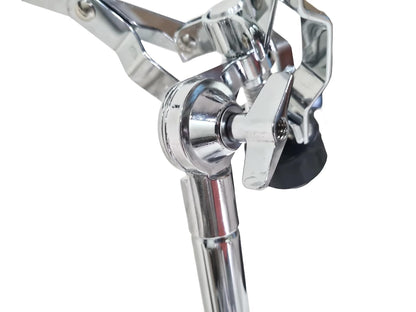Close-up of a chrome drum stand on a white background