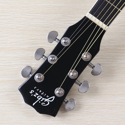 Full view of black acoustic guitar with cutaway