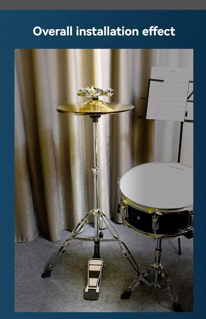 Drum set with stand and cymbal against a curtain backdrop