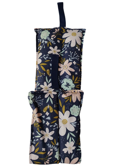 Floral-patterned bag with a strap on a white background