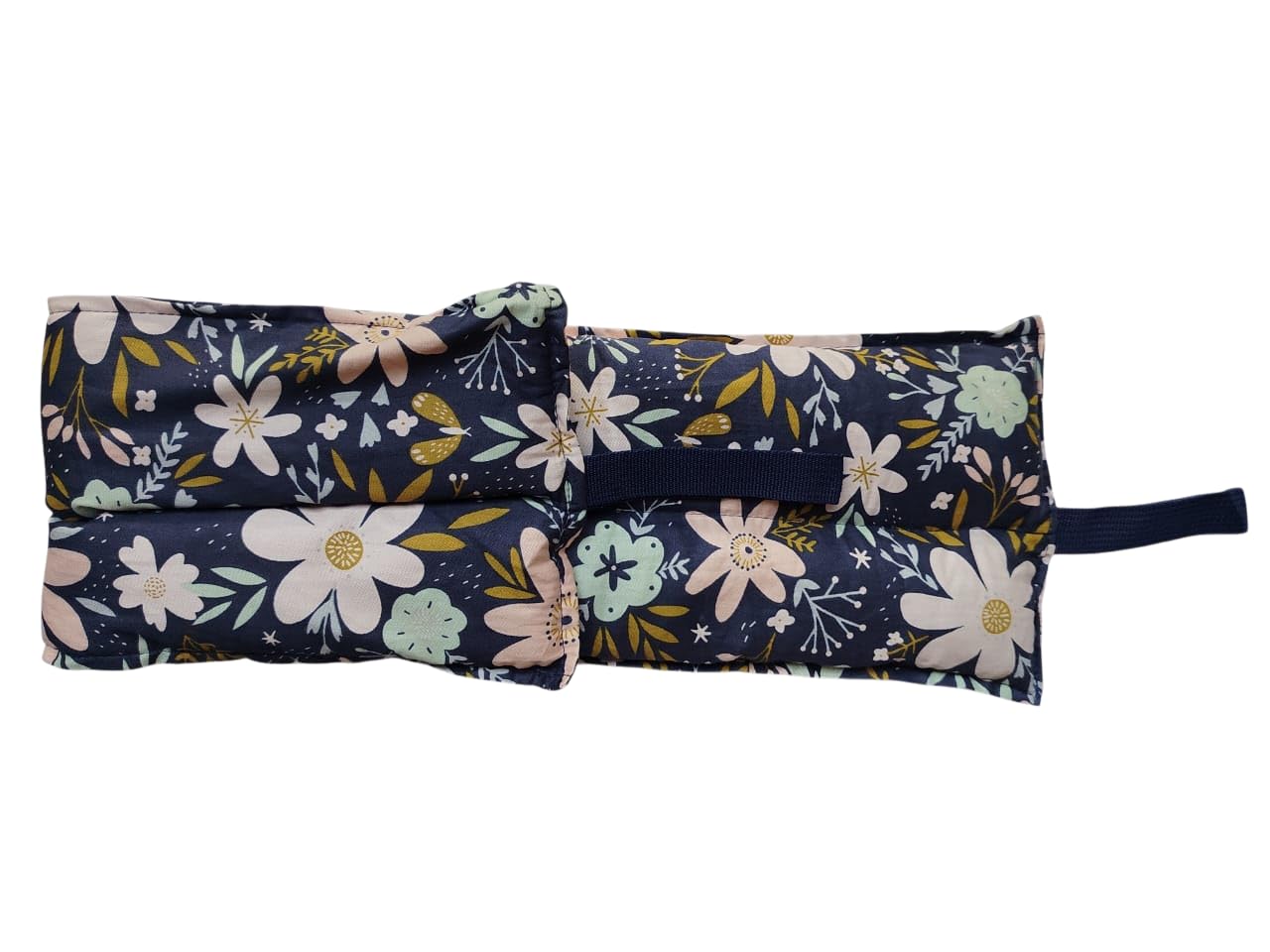 Floral-patterned fabric roll-up with a strap on a white background