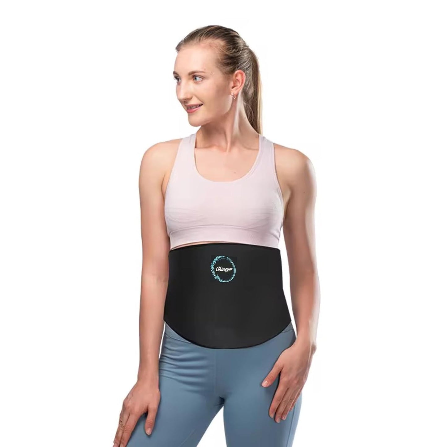 Woman wearing a black waist support belt on a white background