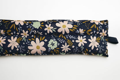 Floral-patterned fabric roll on a white background
