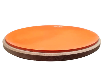 Orange balance board with a white background