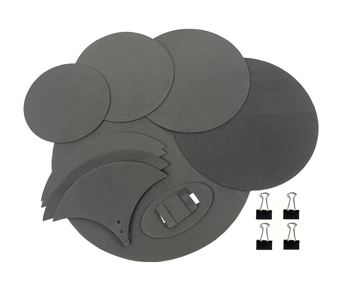 Set of gray circular and oval-shaped adhesive pads with clips on a white background