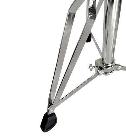 Close-up of a chrome drum stand on a white background
