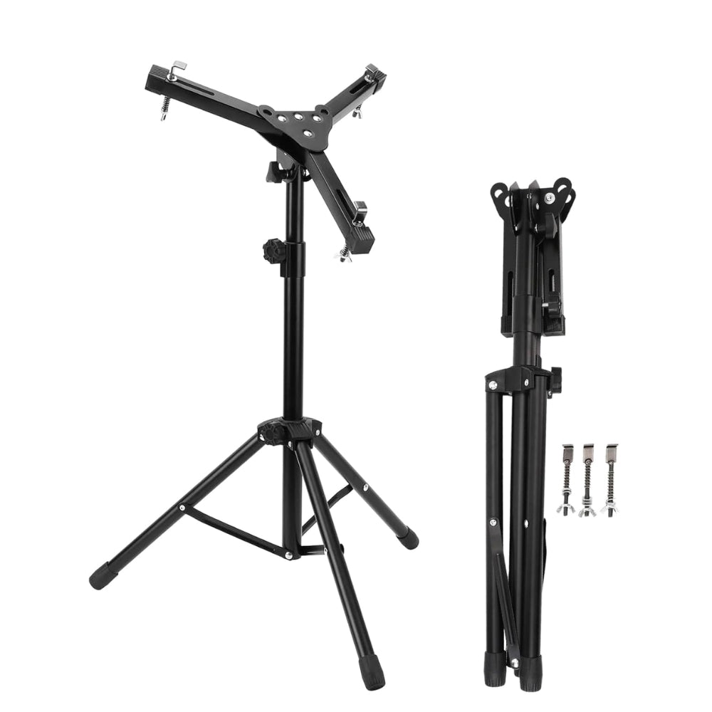 A black drum practice pad stand, showing both the folded and unfolded states, with adjustable height settings and rubber feet.