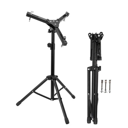 A black drum practice pad stand, showing both the folded and unfolded states, with adjustable height settings and rubber feet.