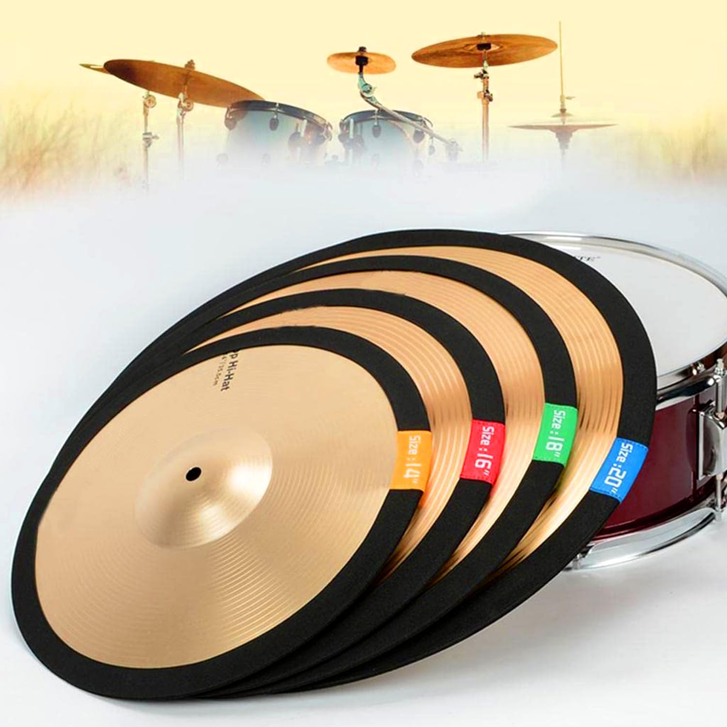 Set of cymbals with color-coded labels in front of a drum set.