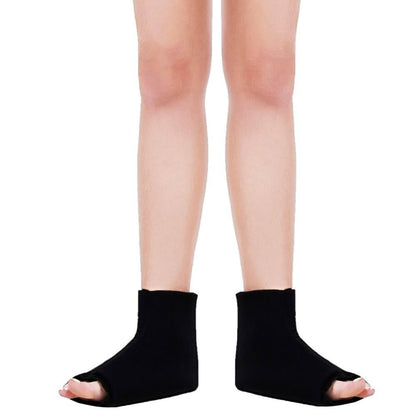 Black open-toe socks worn by a person on a white background