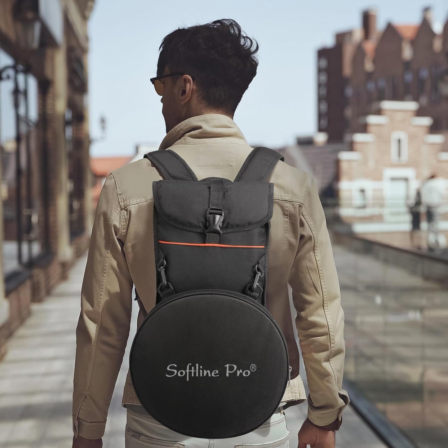 Person wearing a black backpack with 'Sofline Pro' branding on a city street.