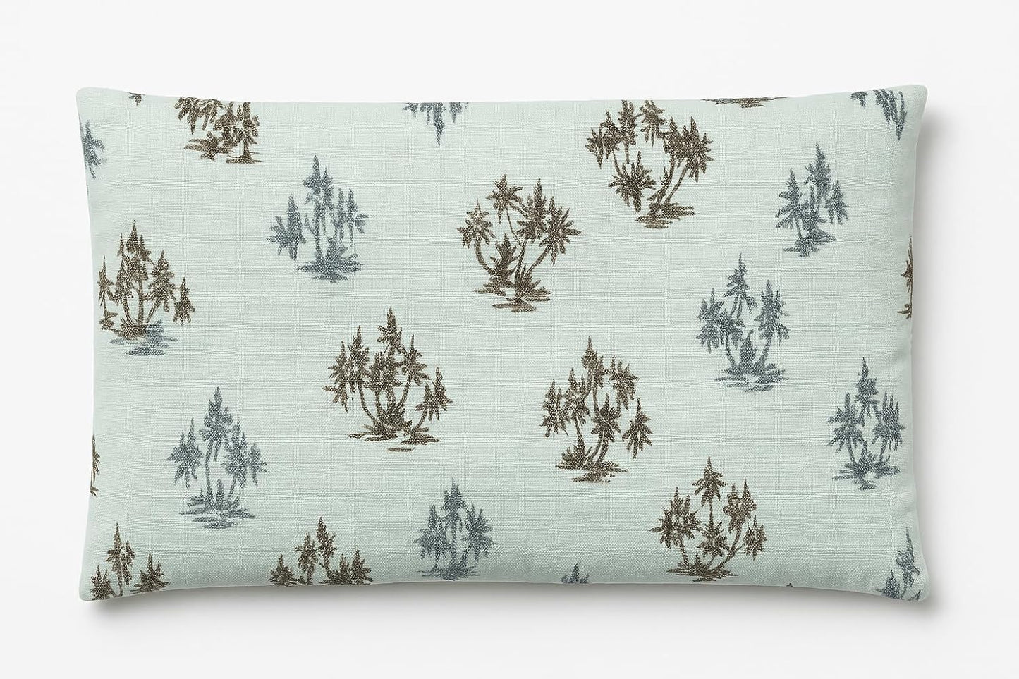 Rectangular pillow with tree pattern on a light green background