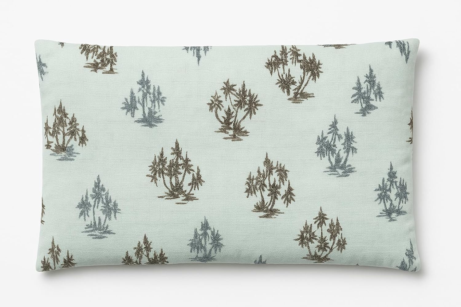 Rectangular pillow with tree pattern on a light green background