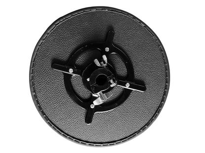 Round black object with central mechanism on a white background