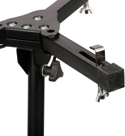 Close-up of a black metal stand with clamps on a white background