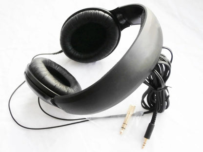 Black headphones with a cable on a white background